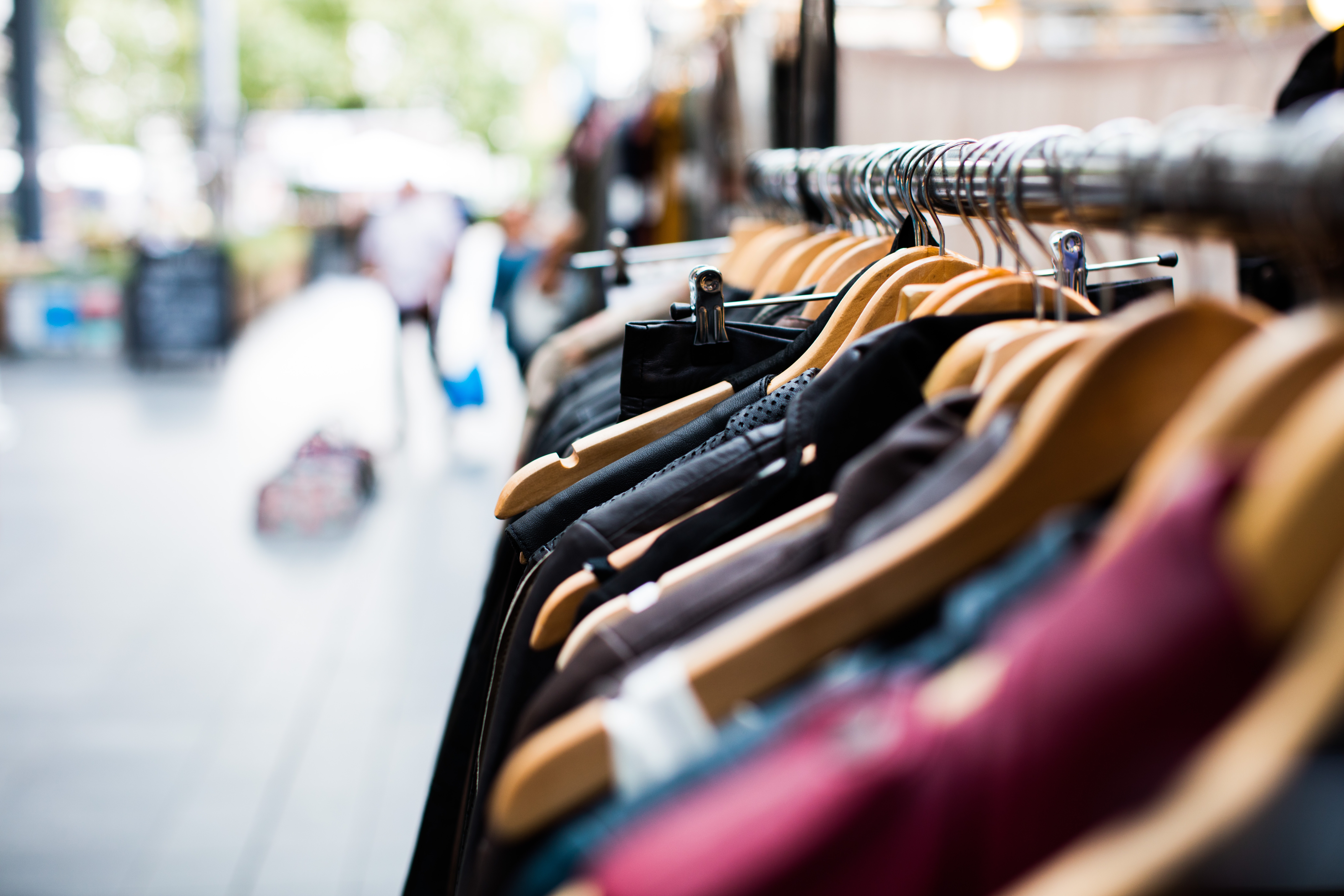 Artificial Photography photo, hangers in a clothes store (via Unsplash)