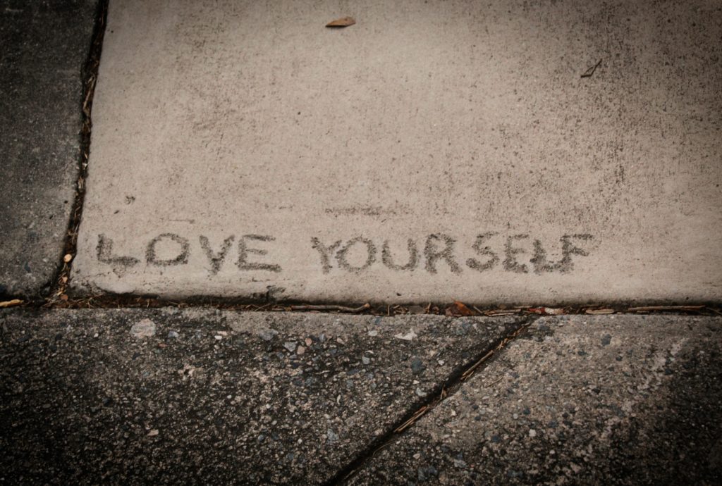 Unsplash photo by Michelle Bonkosky - asphalt/tarmac/Savannah - "love yourself" - visual of showing up for yourself
